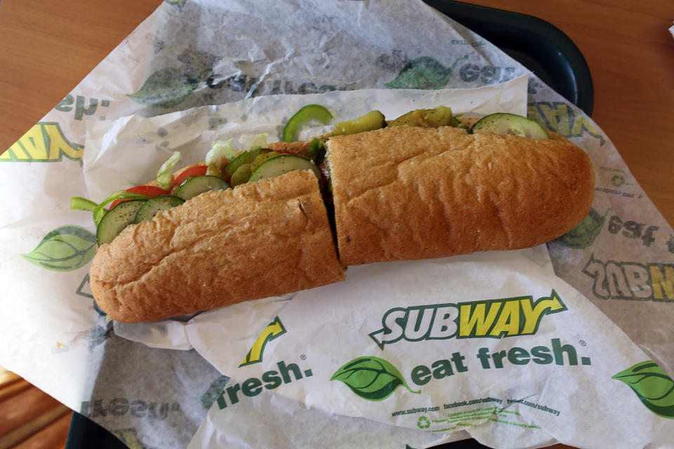 MIAMI, FL - OCTOBER 21:  A Subway sandwich is seen in a restaurant as the company announced a settlement over a class-action lawsuit that alleged that Subway engaged in deceptive marketing for its 6-inch and 12-inch sandwiches and served customers less food than they were paying for on October 21, 2015 in Miami, Florida. While it denies the claims, Subway said that franchisees would be required to have a measurement tool in stores to make sure loaves are 12-inches.  (Photo by Joe Raedle/Getty Images)