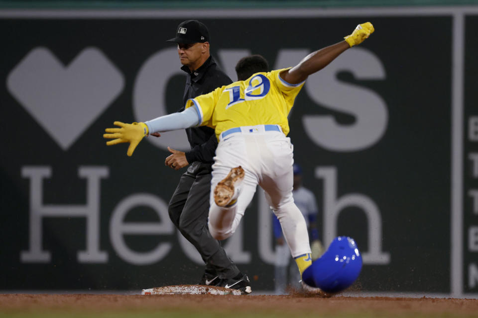 Boston Red Sox's Pablo Reyes (19) dives into second base for a double against the Kansas City Royals during the fifth inning of a baseball game at Fenway Park, Thursday, Aug. 10, 2023, in Boston. (AP Photo/Mary Schwalm)