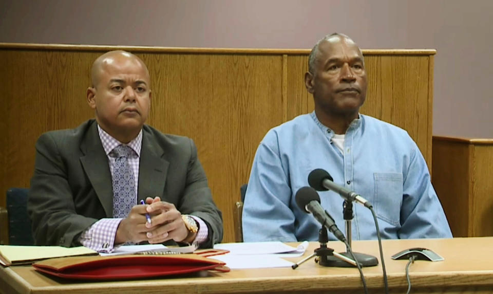 <p>Former NFL football star O.J. Simpson appears with his attorney, Malcolm LaVergne, left, via video for his parole hearing at the Lovelock Correctional Center in Lovelock, Nev., on Thursday, July 20, 2017. Simpson was convicted in 2008 of enlisting some men he barely knew, including two who had guns, to retrieve from two sports collectibles sellers some items that Simpson said were stolen from him a decade earlier. (KOLO-TV via AP, Pool) </p>