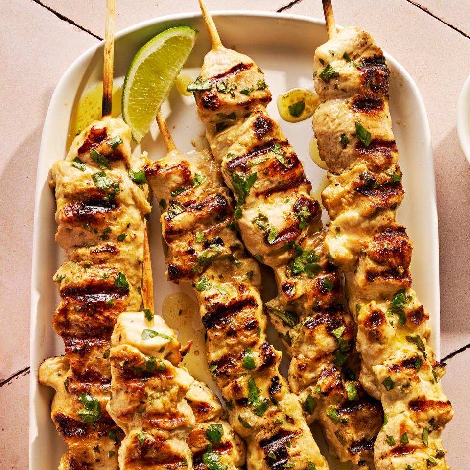 grilled chicken on skewers with lime