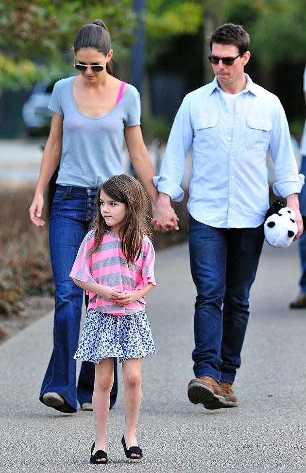 Tom Cruise and Katie Holmes with their daughter Suri in 2011. Photo: Getty Images
