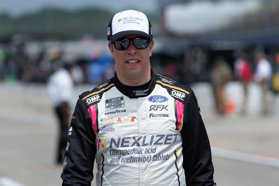 Brad Keselowski walks to his car during qualifications for the FireKeepers Casino 400 at Michigan International Speedway in Brooklyn, Michigan, on Saturday, Aug. 5, 2023.