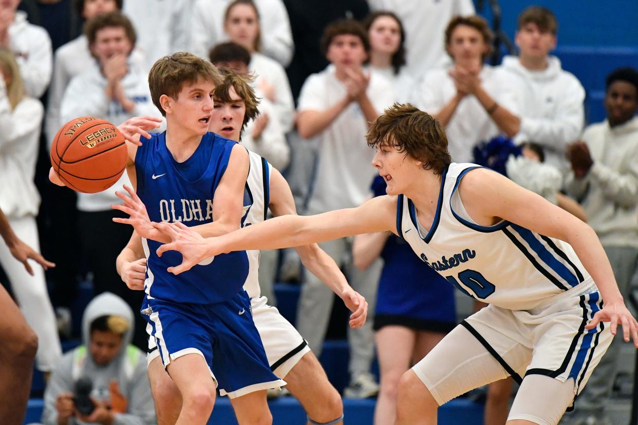 Eastern's Sam Locke tips the ball from Oldham County's Will Hinkle during the second half. Locke tallied 17 points in the loss, and Hinkle knocked down two crucial 3-pointers for the Colonels on Friday night.