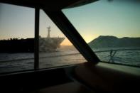 Iranian oil tanker Adrian Darya 1, previously named Grace 1, is pictured from windows as it sits anchored after the Supreme Court of the British territory lifted its detention order, in the Strait of Gibraltar