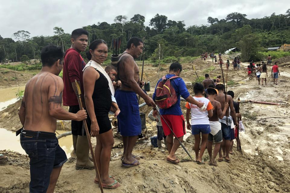 Munduruku warriors try to expel hundreds of illegal gold miners from their territory in Southwestern Para in the Brazilian Amazon, Jan. 26, 2017. Mining has exploded in the region, contaminating hundreds of miles of waterways with debris and mercury. Korap, a Munduruku Indigenous woman from the Brazilian Amazon, has been awarded the prestigious Goldman Environmental Prize for her work fighting against illegal mining and large-scale projects aimed at facilitating soybean exports in the Tapajos River Basin. (AP Photo/Fabiano Maisonnave)