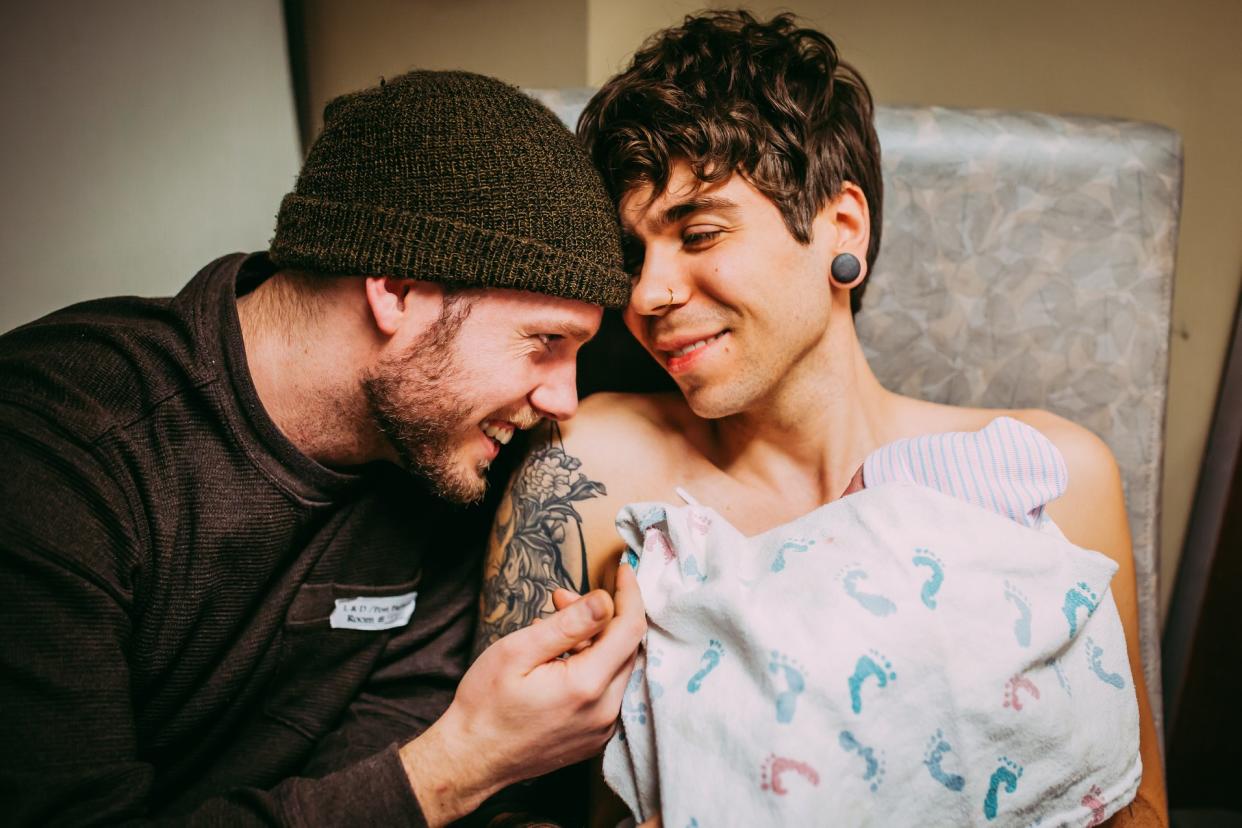 <span>Eledge and Dougherty hold their girl for the first time. (</span>Photo: Supplied/Ariel Panowicz Creative)