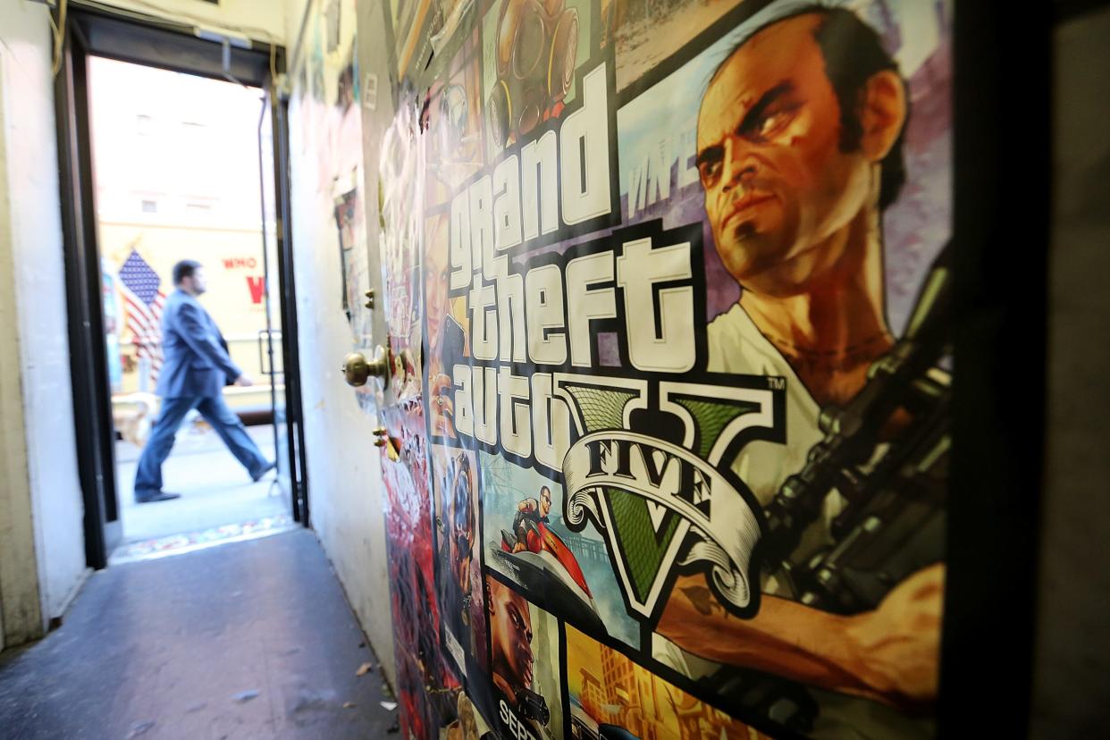 A poster promoting Grand Theft Auto V is attached to a wall at the 8 Bit & Up video games shop in Manhattan's East Village on September 18, 2013 in New York City.