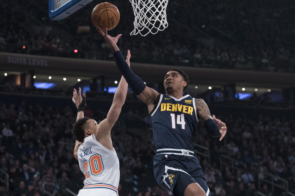 Former Spartan Gary Harris goes to the basket Friday night against Kevin Knox and the Knicks. (AP)