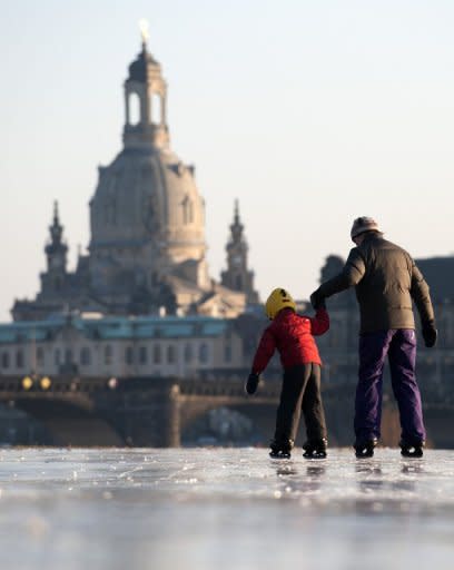 A young boy and his mother skate on the partly frozen river Elbe in Dresden in February. German parents who do not send their under-three-year-olds to a state-sponsored nursery will receive 100 euros ($132) a month from next year, increasing to 150 euros from 2014