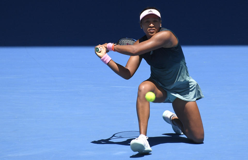 Japan's Naomi Osaka makes a backhand return to Latvia's Anastasija Sevastova during their fourth round match at the Australian Open tennis championships in Melbourne, Australia, Monday, Jan. 21, 2019. (AP Photo/Andy Brownbill)