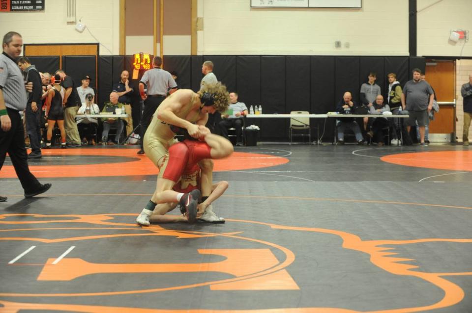 Bald Eagle Area’s Lucas Fye scrambles with Bishop McCort’s Jax Forrest in their 127-pound finals of the Laurel Highlands Athletic Conference tournament on Saturday at Tyrone. Forrest beat Fye, 19-4 in 2:41. Nate Cobler/ncobler@centredaily.com