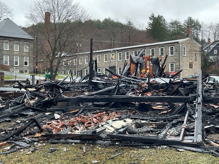 The charred ruins of the White Mills Hotel are seen on the morning of Wednesday, April 3, 2024.