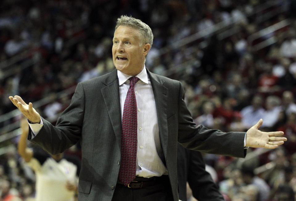 Philadelphia 76ers head coach Brett Brown questions an official's call during the second half of an NBA basketball game against the Houston Rockets, Thursday, March 27, 2014, in Houston. Houston won 120-98. (AP Photo/Bob Levey)