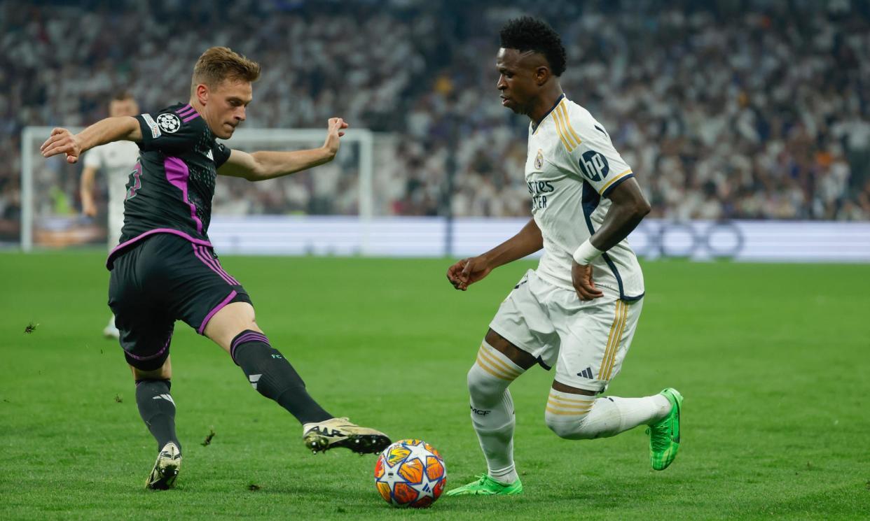 <span>Vinícius Júnior takes Joshua Kimmich to a dark place in Real Madrid’s dramatic victory against Bayern.</span><span>Photograph: JJ Guillen/EPA</span>