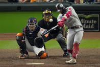 Boston Red Sox's Enrique Hernandez hits a home run against the Houston Astros during the ninth inning in Game 1 of baseball's American League Championship Series Friday, Oct. 15, 2021, in Houston. (AP Photo/Sue Ogrocki)