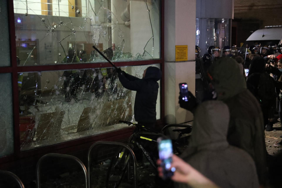 Protester smashes a Bridewell Police Station window as they take part in a 'Kill the Bill' protest in Bristol, demonstrating against the Government's controversial Police and Crime Bill. Picture date: Sunday March 21, 2021. (Photo by Andrew Matthews/PA Images via Getty Images)