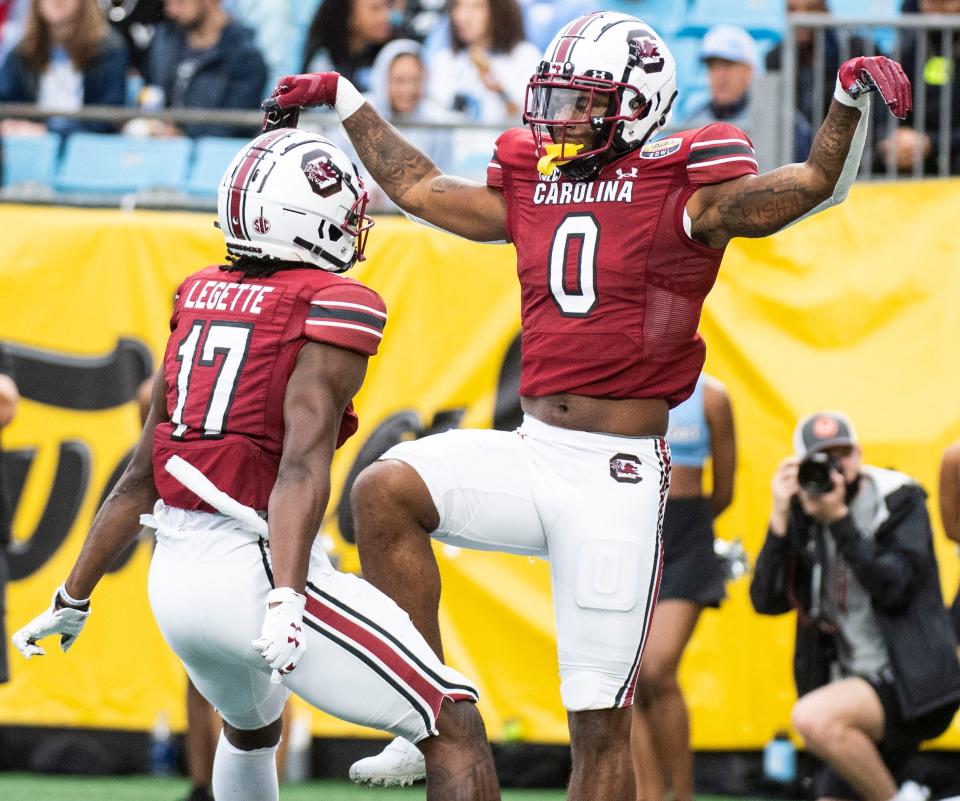 South Carolina tight end Jaheim Bell (0) celebrates with teammate Xavier Legette (17) after scoring against North Carolina during the Duke's Mayo Bowl.