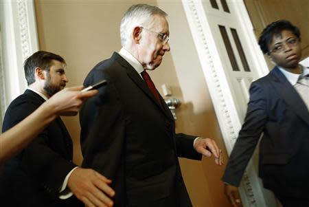 U.S. Senate Majority Leader Harry Reid (D-NV) (C) arrives at a Senate Democratic caucus meeting at the U.S. Capitol in Washington September 30, 2013. REUTERS/Jonathan Ernst