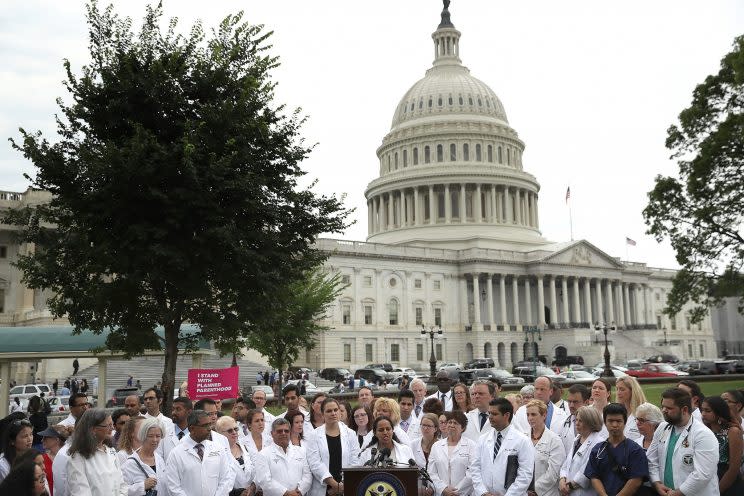 Health care providers hold a news conference outside the U.S. Capitol.