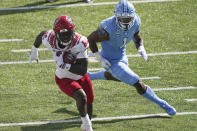 North Carolina State wide receiver Emeka Emezie (86) runs the ball while North Carolina defensive back Kyler McMichael (1) chases during the first half of an NCAA college football game in Chapel Hill, N.C., Saturday, Oct. 24, 2020. (AP Photo/Gerry Broome)