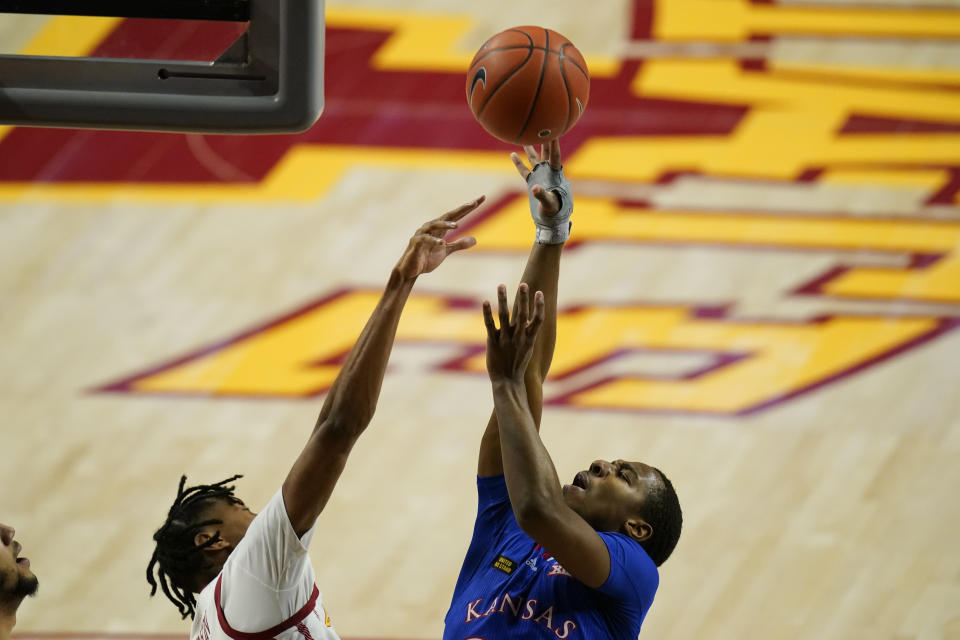 Kansas guard Bryce Thompson shoots over Iowa State forward Javan Johnson, left, during the first half of an NCAA college basketball game, Saturday, Feb. 13, 2021, in Ames, Iowa. (AP Photo/Charlie Neibergall)