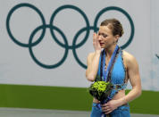 <p>Merely days after losing her mother to a sudden heart attack, Canadian figure skater Joannie Rochette took to the ice at the 2010 Vancouver Games and not only completed her routine, but won bronze. She dedicated the medal to her mother. (AP) </p>