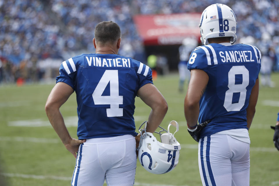 Indianapolis Colts kicker Adam Vinatieri (4) stands on the sideline with holder Rigoberto Sanchez (8) after Vinatieri missed his second extra point of the game against the Tennessee Titans in the second half of an NFL football game Sunday, Sept. 15, 2019, in Nashville, Tenn. (AP Photo/Wade Payne)