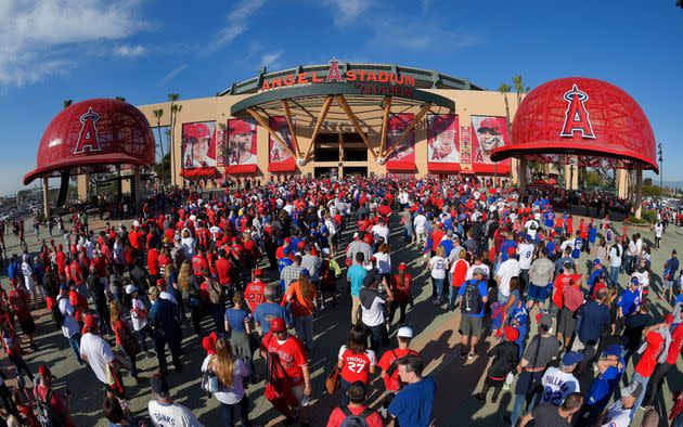 FILE - Fans line up outside Angel Stadium of Anaheim for an opening day baseball game between the Los Angeles Angels and the Chicago Cubs in Anaheim, Calif., on April 4, 2016. The mayor of the Southern California city of Anaheim is resigning amid a swirling political scandal over the sale of Angel Stadium to the baseball team. Mayor Harry Sidhu is quitting his post effective Tuesday, May 24, 2022, his lawyer, Paul S. Meyer, said in a statement Monday. He said the stadium negotiations were lawful and that Sidhu didn't ask for campaign contributions linked to the deal. (AP Photo/Mark J. Terrill, File) (Photo: via Associated Press)