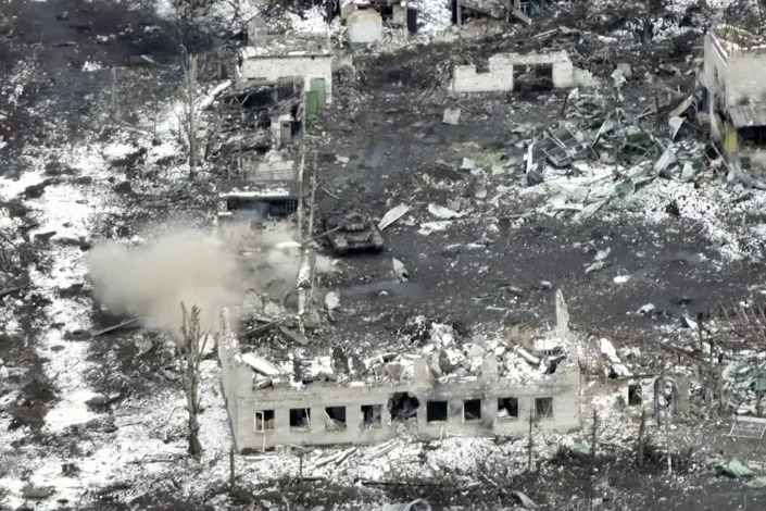 New video footage shot on Feb. 19, 2023 from the air with a drone for The Associated Press shows how particularly intense fighting since the Feb. 24, 2022, invasion has left no building in Marinka intact. Russian tank fire further added to the destruction, pounding what appeared to be Ukrainian positions amid the ruins. (AP Photo)