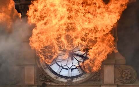 The moment Belfast lost the iconic landmark clock on one of the city's most historic buildings as it was ravaged by fire in August - Credit: Alan Lewis-Photopress Belfast