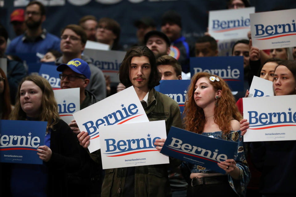 Attendees hold signs during a campaign rally held by Democratic 2020 U.S. presidential candidate and U.S. Senator Bernie Sanders (I-VT) in Sioux City, Iowa, U.S., January 26, 2020. REUTERS/Ivan Alvarado