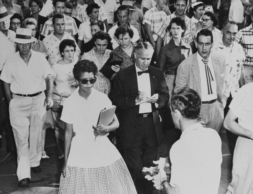 15-year-old Elizabeth Eckford is followed by a sullen mob as she attends her first day at Little Rock Central High School in Little Rock, Arkansas, Sept. 4, 1957.