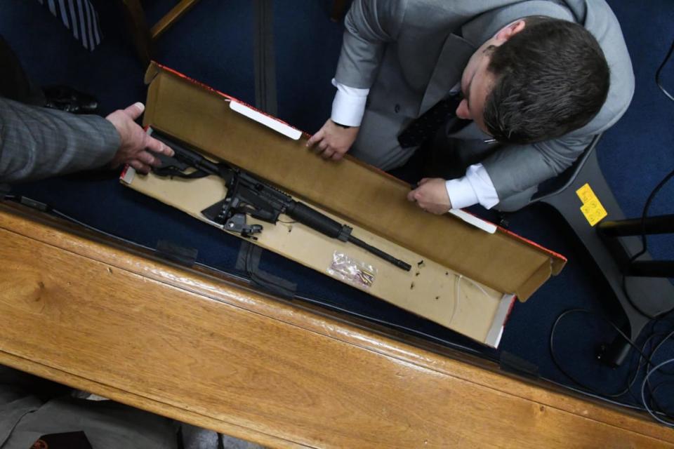 <div class="inline-image__caption"><p>Defense attorney Mark Richards asks Kenosha Police Detective Ben Antaramian to show him Kyle Rittenhouse's rifle and bullets during the trial.</p></div> <div class="inline-image__credit">Mark Hertzberg/Pool via Getty</div>