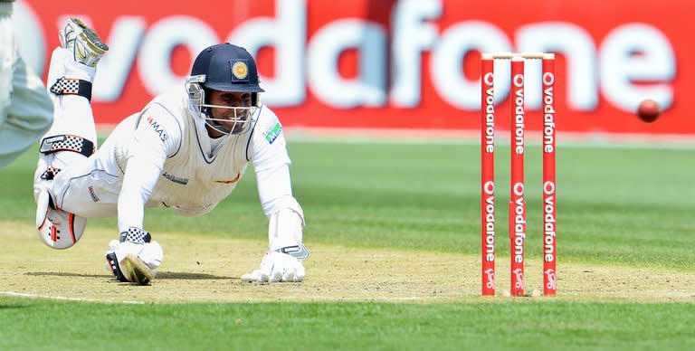 Sri Lanka's Angelo Mathews dives for his crease as the Australian throw misses the stumps on the third day of the first Test match in Hobart on December 16, 2012. Sri Lanka will be encouraged by their ODI record in Australia, with four wins in seven matches last year, while they claimed their first-ever series win in Australia 2-1 in 2010