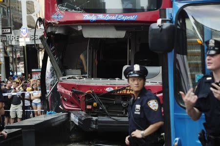 Double-decker tour buses collide in Times Square