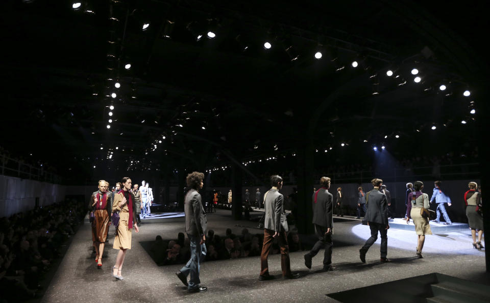 Models wear creations for Prada men's Fall-Winter 2014 collection, part of the Milan Fashion Week, unveiled in Milan, Italy, Sunday, Jan.12, 2014. (AP Photo/Luca Bruno)