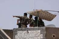 <p>Syrian Democratic Forces (SDF) fighters stand atop of a building near Raqqa city, Syria June 7, 2017. (Photo: Rodi Said/Reuters) </p>