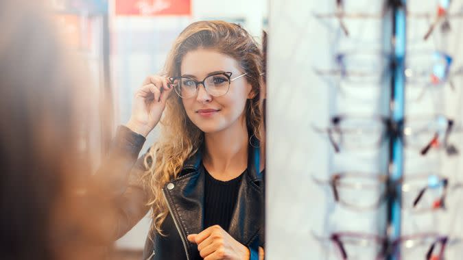 girl trying on glasses