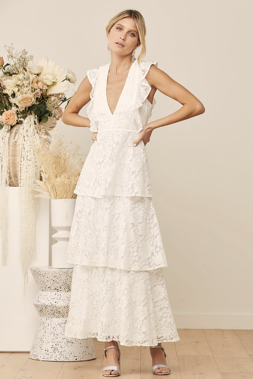 blonde model wearing white lace dress, Molinetto White Lace Ruffled Tiered Sleeveless Maxi Dress (photo via Lulus)