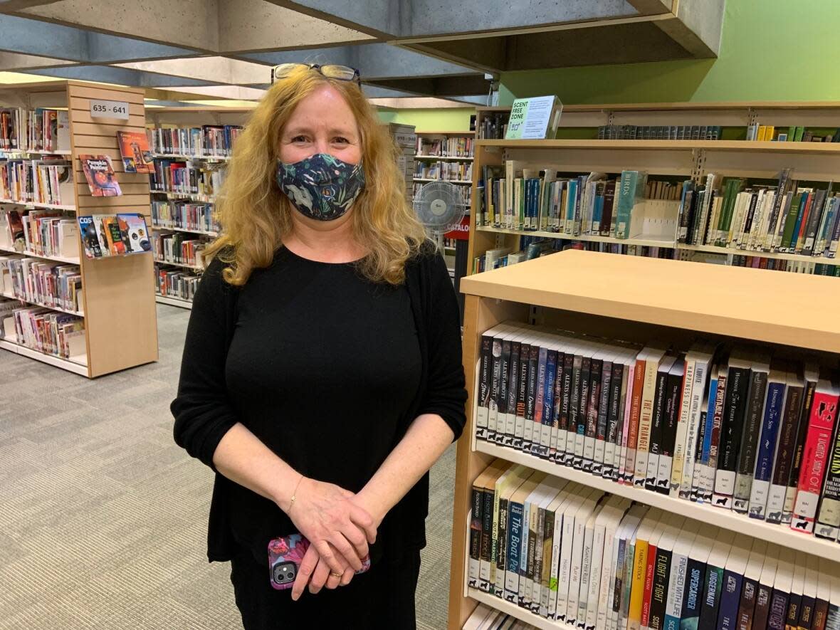 Susan Prior, St. John's Public Libraries manager, says people who have come in for help with the passport have discovered other resources offered by the library. (Darrell Roberts/CBC - image credit)