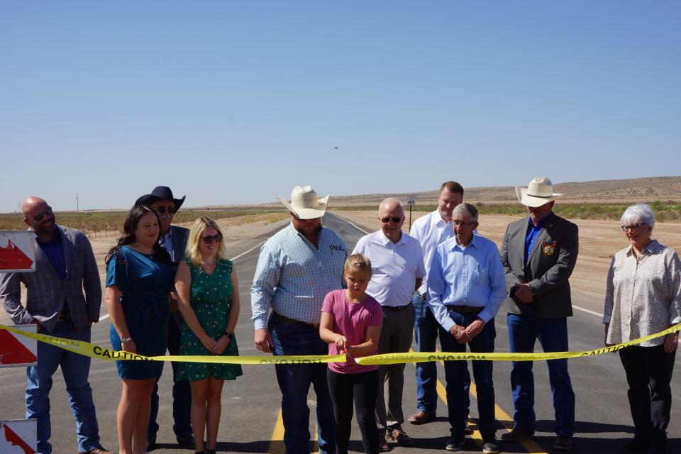 Dignitaries from the State of New Mexico, Eddy County and the City of Carlsbad gather for a ribbon cutting ceremony for the new West Loop Road on July 18, 2023.