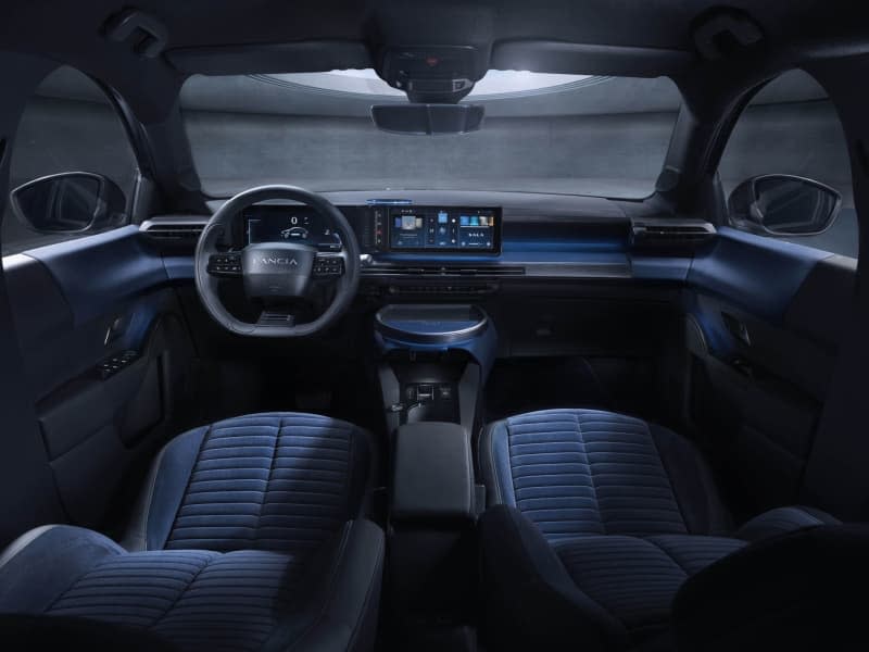 On the inside, the oversized door handles stand out, along with the 10.25-inch infotainment display "cannelloni"style pattern on the seats and a table-like center console, designed to make the interior feel a little more like a lounge.  Lancia/dpa