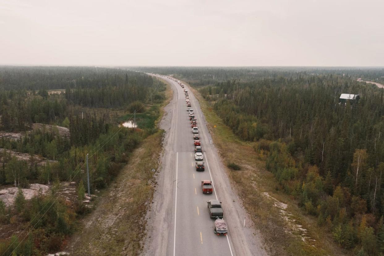 On Aug. 16, Yellowknife residents left the city in a long line down Highway 3, the only highway in or out of the community. (Pat Kane/Reuters - image credit)