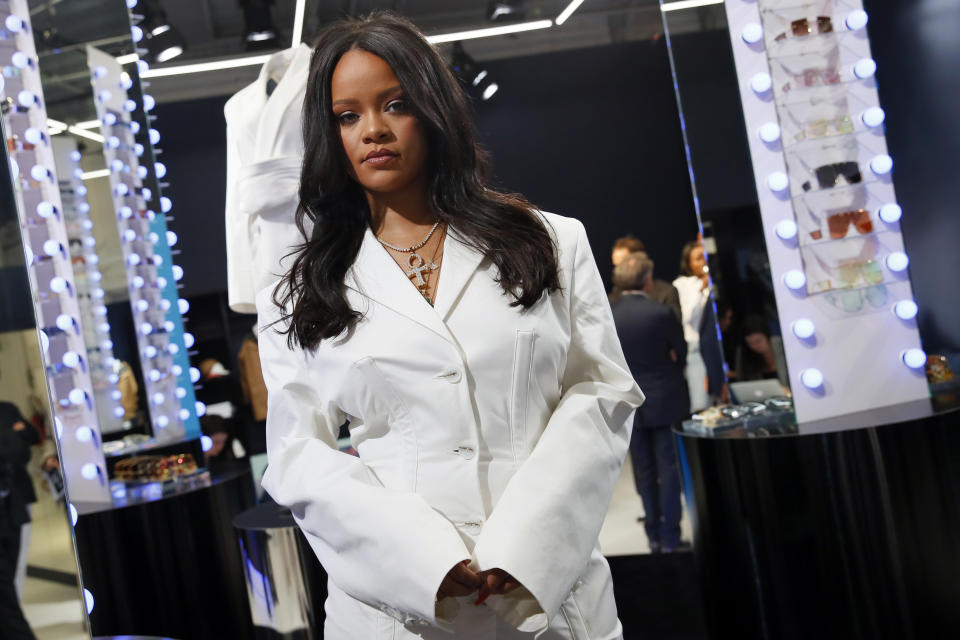 Rihanna poses as she unveils her first fashion designs for Fenty at a pop-up store in Paris, France, Wednesday, May 22, 2019. Singer Rihanna is the first black woman in history to head up a major Parisian luxury house, and the collection, named after the singer turned designer's last name, comprises of ready-to-wear, footwear, accessories, and eyewear and is available for sale Paris' Le Marais area from Friday and will debut online May 29. (AP Photo/Francois Mori)