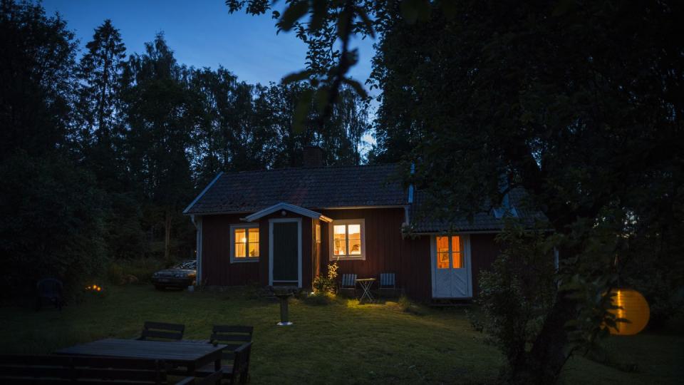 cottage in forest in the evening