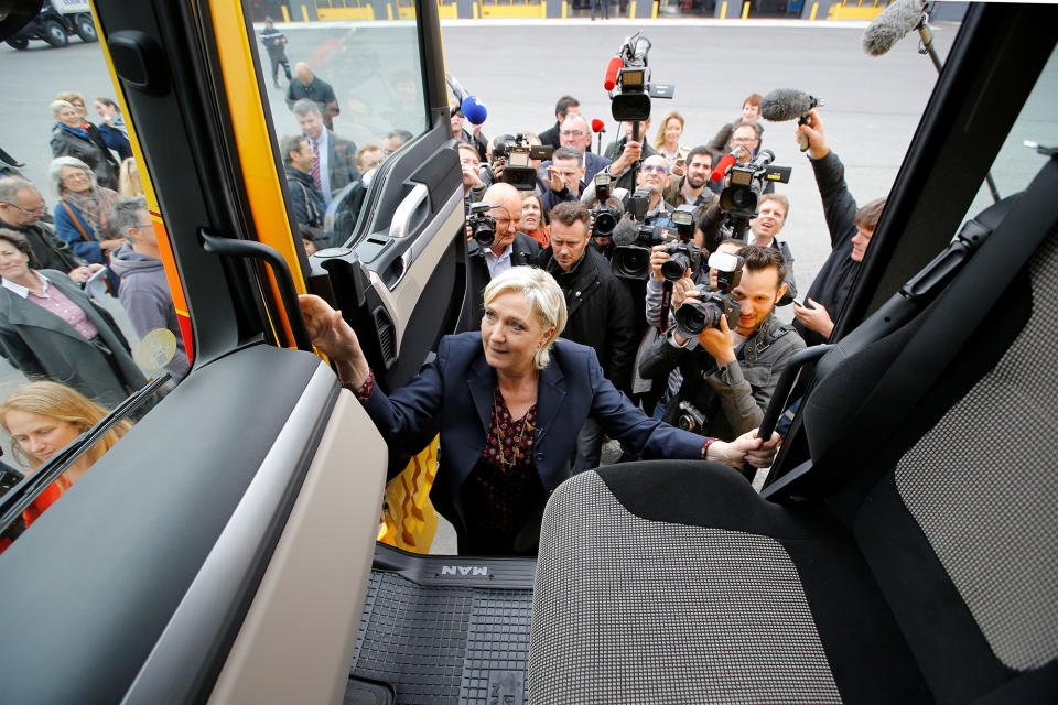 <p>Marine Le Pen, French National Front (FN) party candidate for 2017 presidential election, climbs into a truck during a campaign visit in Dol-de-Bretagne, France, May 4, 2017. (Stephane Mahe/Reuters) </p>