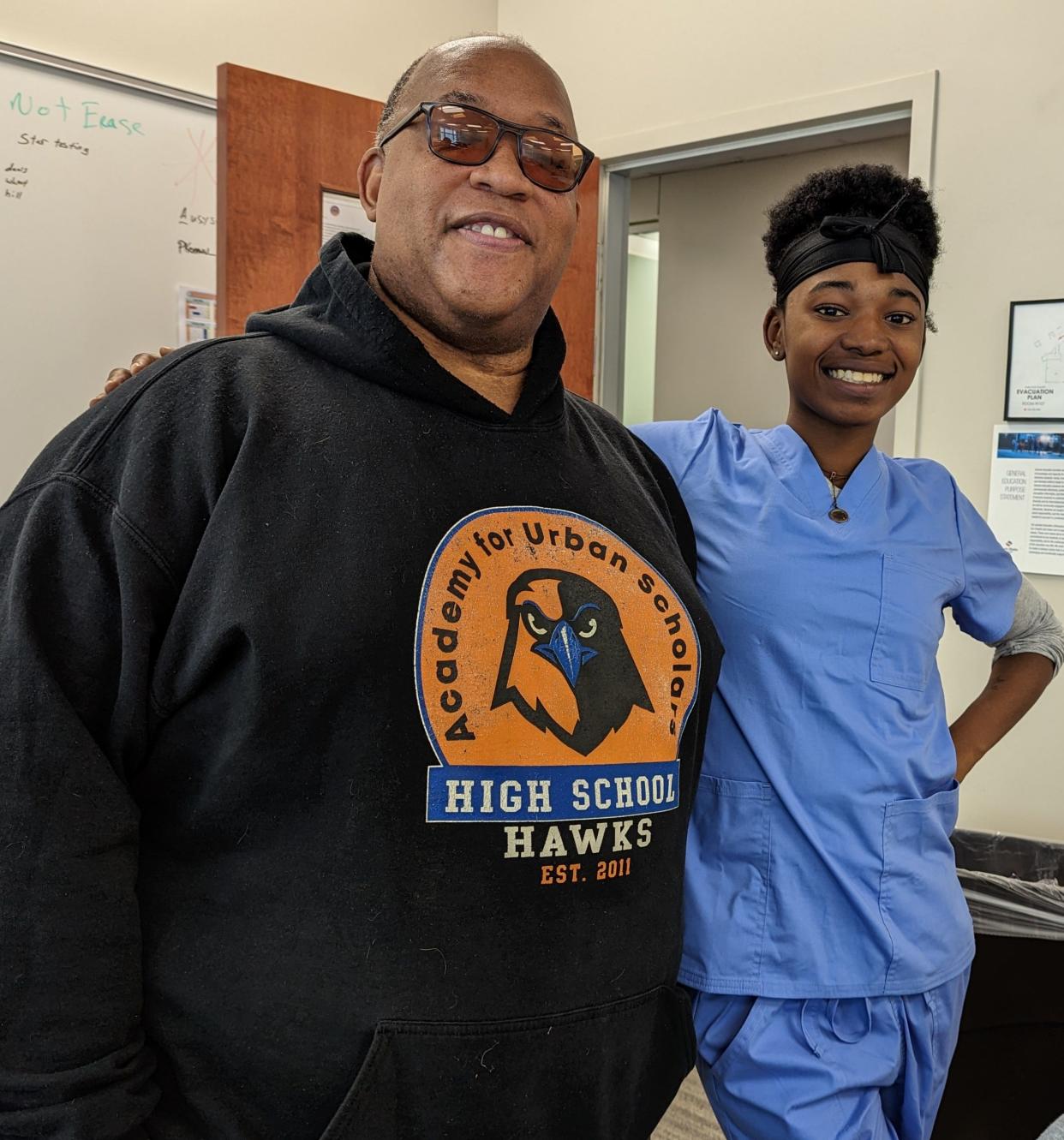 Samuel Muhammad, executive director of the Academy for Urban Scholars High School's Canton campus, is shown with student Rae'Ynna Burwell, 22. The school helps young adults acquire enough credits for their high school diplomas while offering workforce development.