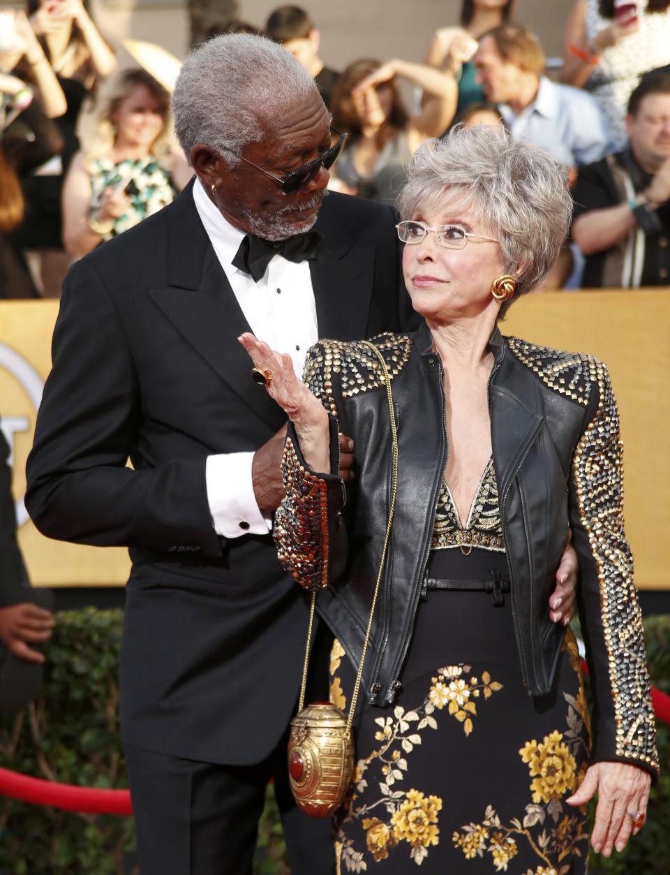 Actor Morgan Freeman and SAG Award honoree Rita Moreno arrive at the 20th annual Screen Actors Guild Awards in Los Angeles, California January 18, 2014. REUTERS/Lucy Nicholson (UNITED STATES Tags: ENTERTAINMENT)(SAGAWARDS-ARRIVALS)