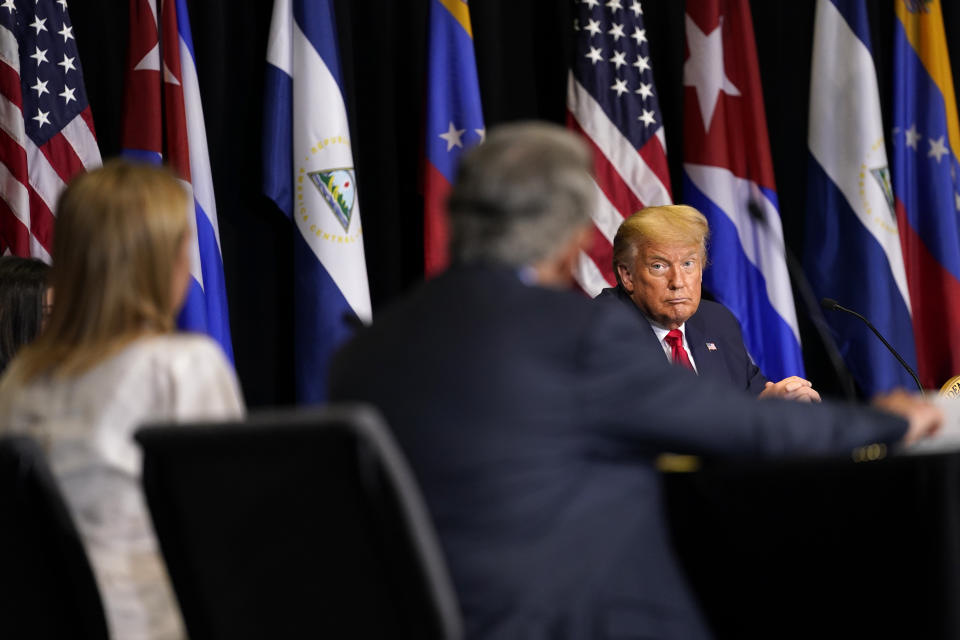 President Donald Trump listens during a roundtable on Venezuela at Iglesia Doral Jesus Worship Center, Friday, July 10, 2020, in Doral, Fla. (AP Photo/Evan Vucci)