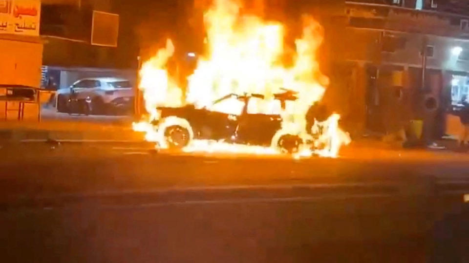 A car burns following what the U.S. military says was a deadly drone strike on a Kataib Hezbollah commander, in Baghdad, Iraq, Feb. 7, 2024, in this screengrab from social media video obtained by Reuters. / Credit: Social media video obtained by Reuters